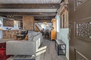 a living room with a couch and a table at Glacier Peak Getaway | Wifi, Fireplace, Lower Timb in Packwood