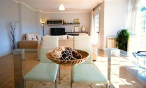 a living room with a couch and a table at Casa Olivar El Mandarino in Orazo +21 photos