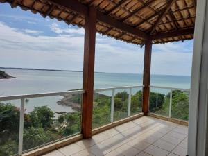 a view of the ocean from the balcony of a house at Casa Nascer do Sol- Iriri-ES in Anchieta