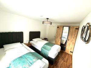 Uma cama ou camas num quarto em COVE Appart