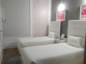 Cama o camas de una habitación en Royal Porto City