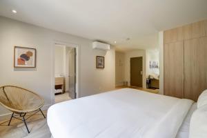 Postel nebo postele na pokoji v ubytování Suites du Lac Moore
