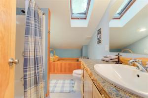 a bathroom with a sink and a toilet at Elk House in Packwood +31 photos