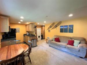 a living room with a couch and a table at Mountain View | Wifi, Smart TV, In town in Packwood