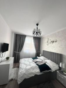 Ένα ή περισσότερα κρεβάτια σε δωμάτιο στο Apartament Diana