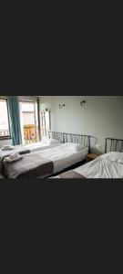 A bed or beds in a room at ELSADA