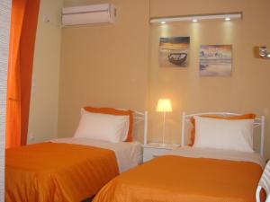 Ліжко або ліжка в номері Sandra's Sea View at Sounio