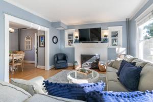 a living room with a couch and a fireplace at The Goat Locker in Annapolis
