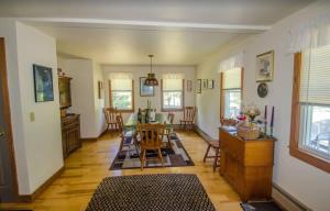 a kitchen and dining room with a table and chairs at Centrally Located Capacious 3 Bedroom in Truro