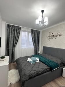 Ένα ή περισσότερα κρεβάτια σε δωμάτιο στο Apartament Diana