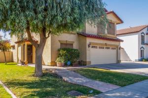 a house with a tree and a driveway at Sunny Retreat in Glendale in Glendale