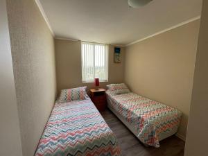 Postel nebo postele na pokoji v ubytování Departamento Laguna Vista
