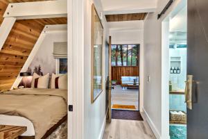 a bedroom with a bed in a room with a staircase at Elati Escape in South Lake Tahoe +19 photos