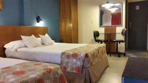 Кровать или кровати в номере Hotel Amalfi