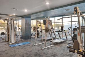 a gym with several tread machines in a room at Expansive views - 1BD 1BA Hot Tub, Pool, Convention Centre in Salt Lake City