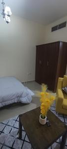 a living room with a coffee table and a bed at Daily Basis Furnished rooms Deira in Dubai