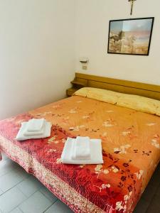 Llit o llits en una habitació de Hotel Croce Del Sud