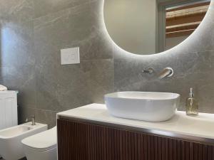 a bathroom with a sink and a mirror at Casa faro in Realmonte