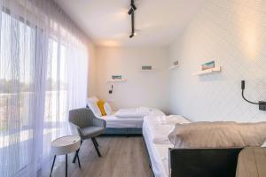 Posteľ alebo postele v izbe v ubytovaní Balaton Bliss Lakeside Apartment