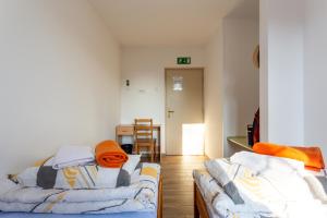 Postel nebo postele na pokoji v ubytování Yapka Rooms
