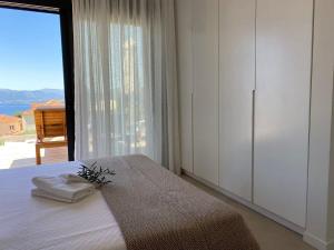 Postel nebo postele na pokoji v ubytování Villa Ilios