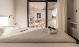 a bedroom with a bed with a view of a patio at Villa Oneiro in Paleros