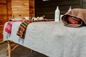 a table with a blanket and bottles on it at Oaza Spokoju 1 in Wersk +93 photos