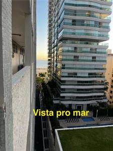 a view from the balcony of a tall building at Praia do Gonzaga Santos SP Apto 2 quartos in Santos