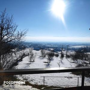 a snow covered hill with the sun in the background at Harmonija - Jasenica in Valjevo +30 photos