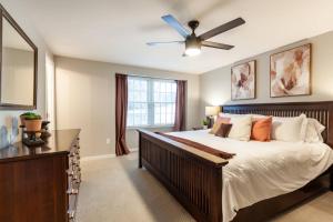 a bedroom with a large bed and a ceiling fan at Liberty Call in Arnold +42 photos