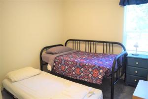 a bedroom with two bunk beds and a window at Rustic Rapids · Wood Stove, Creek, Sauna in Packwood
