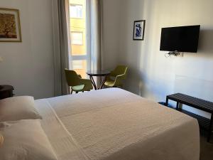 Postel nebo postele na pokoji v ubytování G House