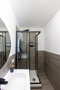 a bathroom with a shower and a sink at Urban Chic Luxury Suite Apartments in Rome +51 photos