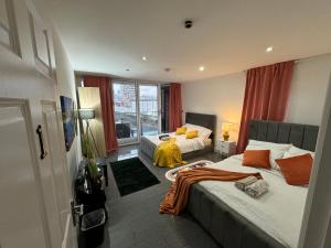 a hotel room with two beds and a window at Cosy Luxurious Room in The Heart of London in London