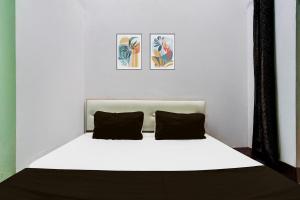 Ένα ή περισσότερα κρεβάτια σε δωμάτιο στο Hotel O Laddu Hotel