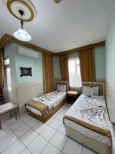 a room with two beds in a room at Best Life Apart Hotel in Alanya +19 photos