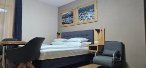 Postel nebo postele na pokoji v ubytování apartmány Špacír
