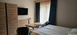 Postel nebo postele na pokoji v ubytování apartmány Špacír