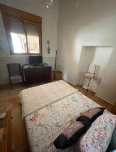Postel nebo postele na pokoji v ubytování Cortijo de la montaña