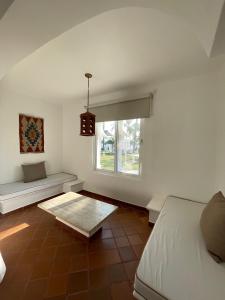 a bedroom with a bed and a window at Hotel Aldea del Bazar & Spa in Puerto Escondido +43 photos