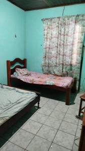 Postel nebo postele na pokoji v ubytování Hospedagem Casa grande