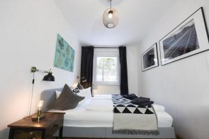 a small bedroom with a bed and a window at Oberwiesenthal Apartments in Kurort Oberwiesenthal