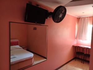 Postel nebo postele na pokoji v ubytování Hotel Fascinação