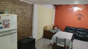 a living room with a table and a couch at XayEm Apart in Villa Carlos Paz