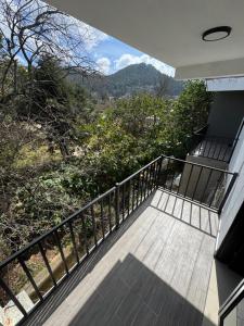 a balcony of a house with a view at Casas Victoria in San Cristóbal de Las Casas