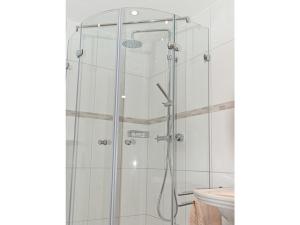 a shower with a glass door in a bathroom at Casa Schalkenmehren Grande in Schalkenmehren +12 photos