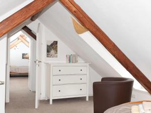 a bedroom with a white dresser in a attic at Casa Schalkenmehren Grande in Schalkenmehren