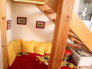 a childs room with a bunk bed under a stairs at Holiday home chalet on the castle hill in Brotterode-Trusetal