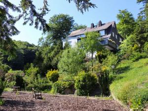 a house on the side of a hill at The Waldhaus Modern retreat in Neerdar