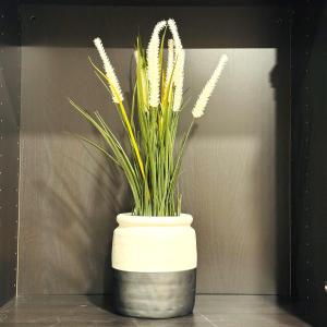 a white vase with a plant in it at Beautiful 5bedroom farmhouse 15 min from Canberra CBD in Sutton